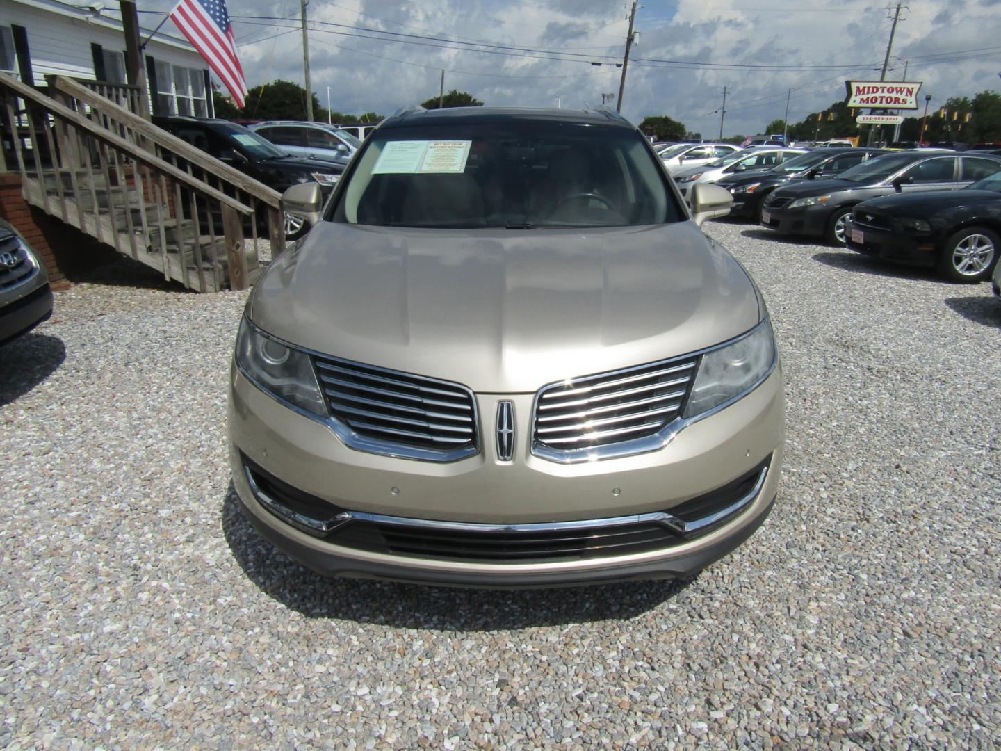 2017 Gold /Tan Lincoln MKX Reserve (2LMPJ6LR8HB) with an 3.7L V6 DOHC 24V engine, Automatic transmission, located at 15016 S Hwy 231, Midland City, AL, 36350, (334) 983-3001, 31.306210, -85.495277 - Photo#1